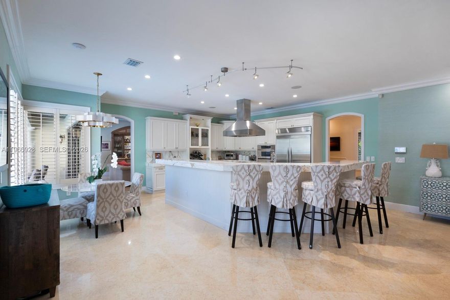 Fabulous 2007-built 5/5.5 family home on quiet great street in north Pinecrest.  High ceilings, impact glass windows and French doors, Egyptian marble floors, generator, gas cooktop, gas dryer, gas water heater, and a working fireplace.   Ideal split floor plan layout includes a fabulous and large open kitchen/ family room and breakfast room, 2-story primary suite wing, full cabana bath, 2-car garage, interior utility room, big walk-in closets, gorgeous built-in wet bar, and more!  Tranquil, private, and easy-to-maintain pool-patio-yard area includes Chicago brick, gazebo and turf.  All the best Pinecrest schools and central location to all the Village has to offer.
