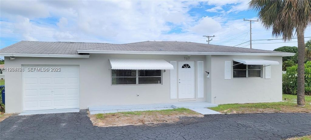 Photo of 707 Greenbriar Dr, Lake Park, FL 33403 (MLS # A11934828)