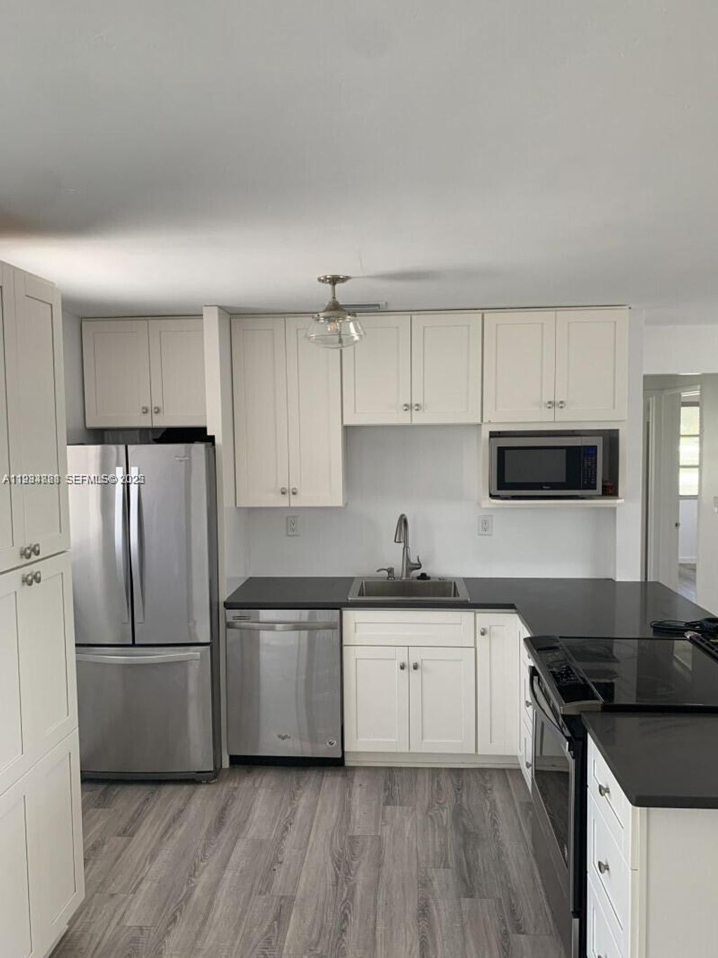 Photo of 707 Greenbriar Dr, Lake Park, FL 33403 (MLS # A11934828)