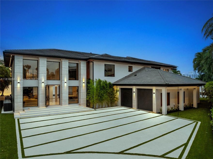 Stunning new 6 bed, 7.5 bath modern estate with 240 feet of prime water frontage and breathtaking open bay views. Designed for luxury living and entertaining, it features a saltwater pool, private sauna, rooftop deck, movie theatre, and outdoor kitchen. Inside, enjoy top-of-the-line appliances, spacious walk-in closets, and sleek designer finishes throughout. The open layout flows seamlessly to outdoor spaces. Complete with a private boat dock, this is resort-style waterfront living at its finest.