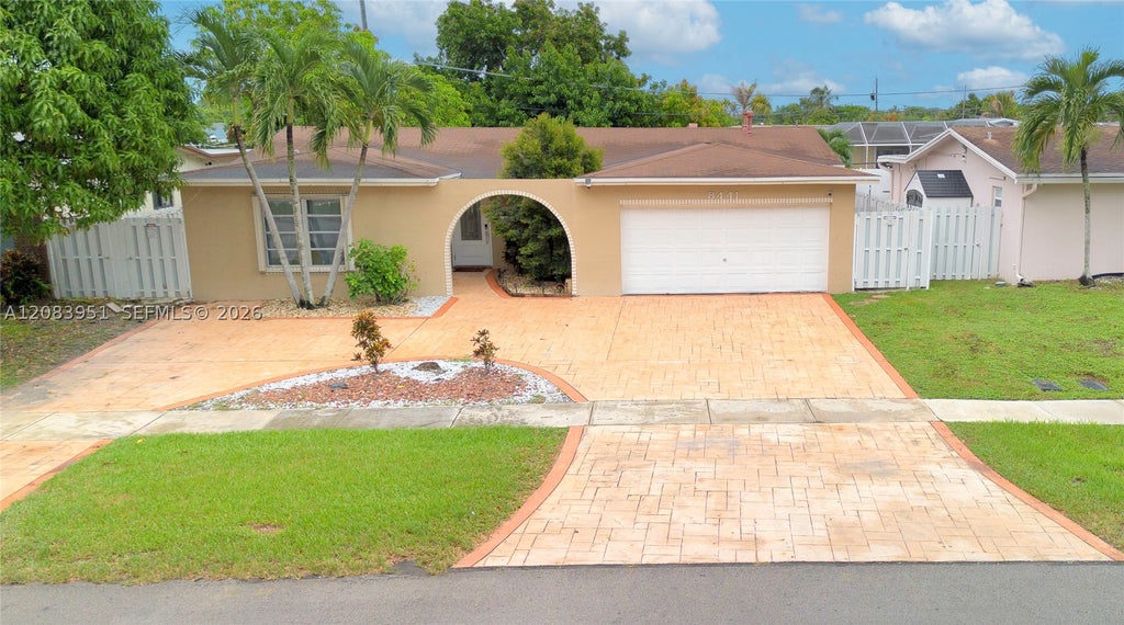 Photo of 8441 Sunset Strip, Sunrise, FL 33322 (MLS # A12083951)