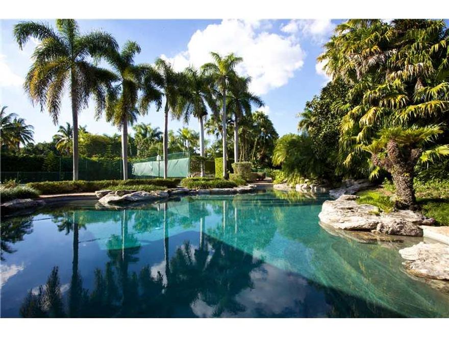 Spectacular trophy property! Tropical paradise of 2 acres family compound.Lush grounds graced w/ majestic oaks &tropical plantings.Elicit storybook backdrop of serenity.This classic and timeless estate was rebuilt & expanded by Hollub Home in 2012 w/the m ost luxurious appointments throughout.Meticulous craftsmanship & exquisite finishes.Features include high ceiling,marble and wood flrs,stunning state of art kitchen. Sep.Cabana-guest house,tennis court,oversized lagoon pool.Much more.Truly extraordinaire!