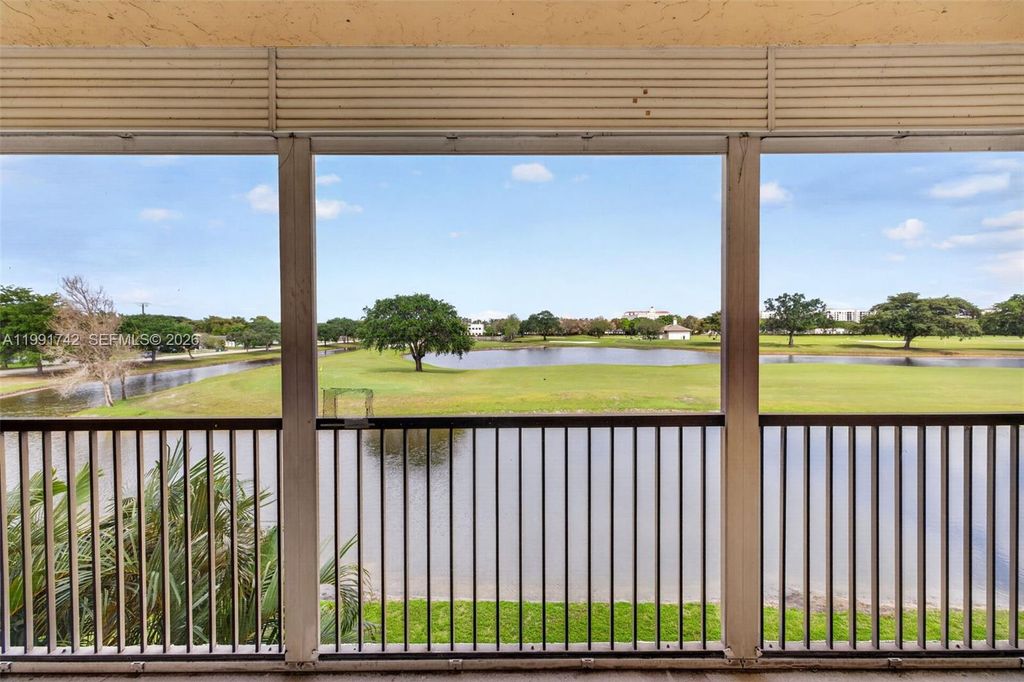Photo of 3100 W Rolling Hills Cir #303, Davie, FL 33328 (MLS # A11991742)