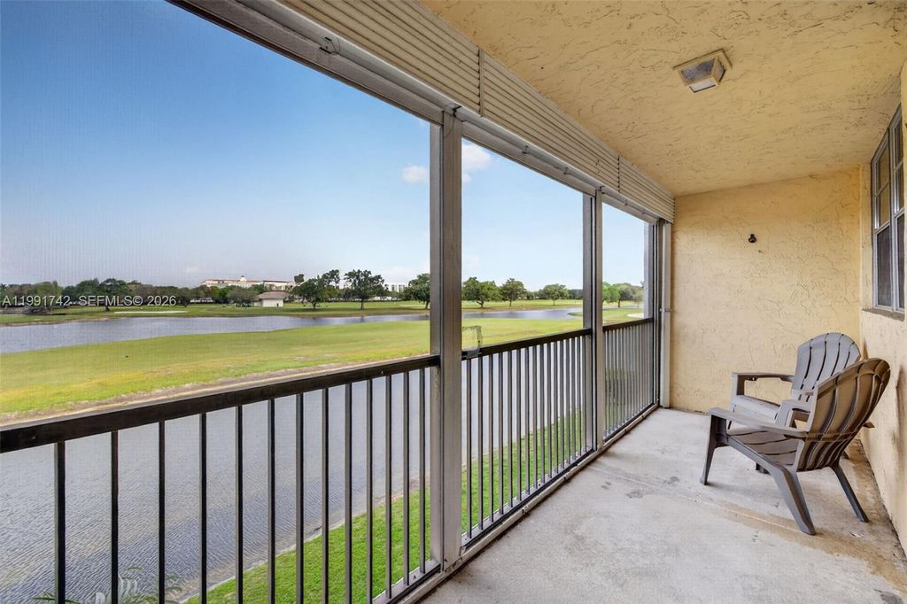 Photo of 3100 W Rolling Hills Cir #303, Davie, FL 33328 (MLS # A11991742)
