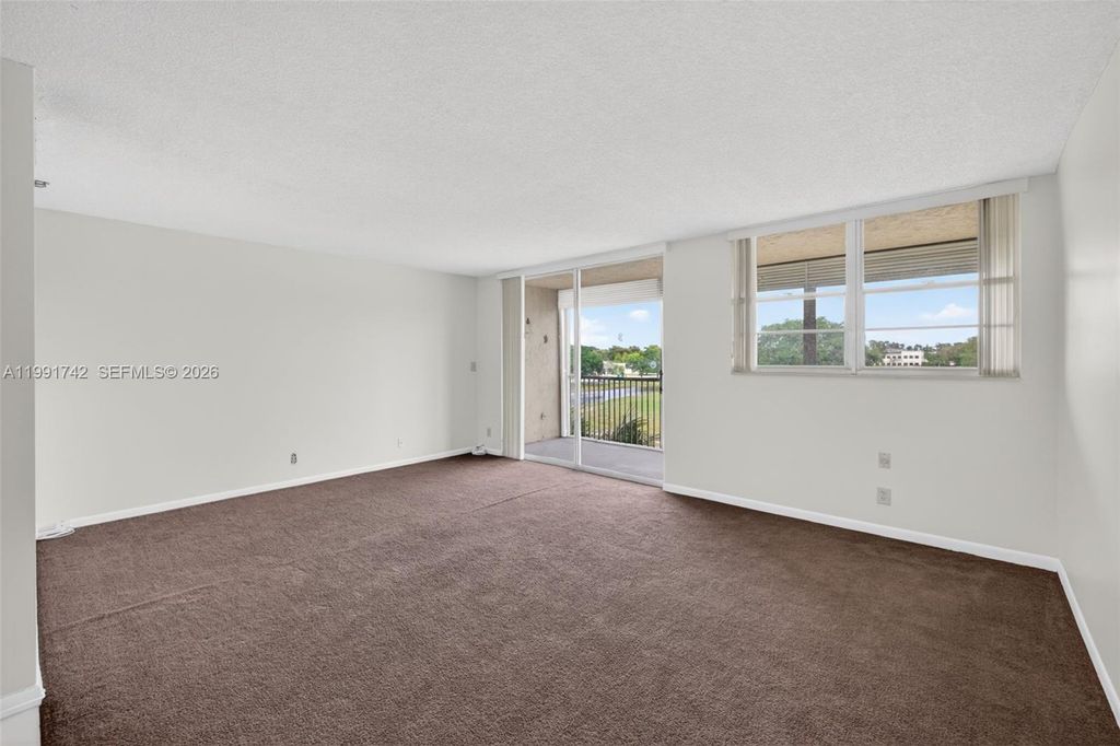 Photo of 3100 W Rolling Hills Cir #303, Davie, FL 33328 (MLS # A11991742)
