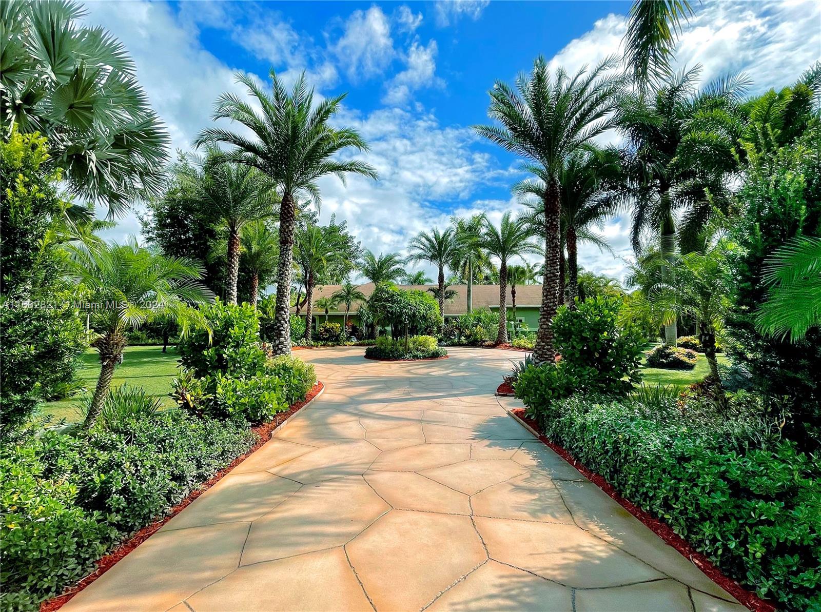 Extraordinary 10.36-acre natural oasis in west Jupiter. Fully fenced & gated along with two exceptional homes with a 5-acre crystal clear spring-fed bass lake in the middle. The best part is this property comes with a turn-key business that runs itself and generates over $100k annually included with the sale. Between both homes there are 7 bedrooms/5 bathrooms /over7000 sqft of total living space & over 4800 sqft under air. Adding to the versatility is a 1428 sqft fully insulated steel building, home office, home gym, outdoor kitchen, home brewery, art studio, fire pits & tiki huts. Of course a property like this would not be complete without a spectacular infinity pool overlooking the lake. Take a tour of an incredible lifestyle with your income-producing resort.