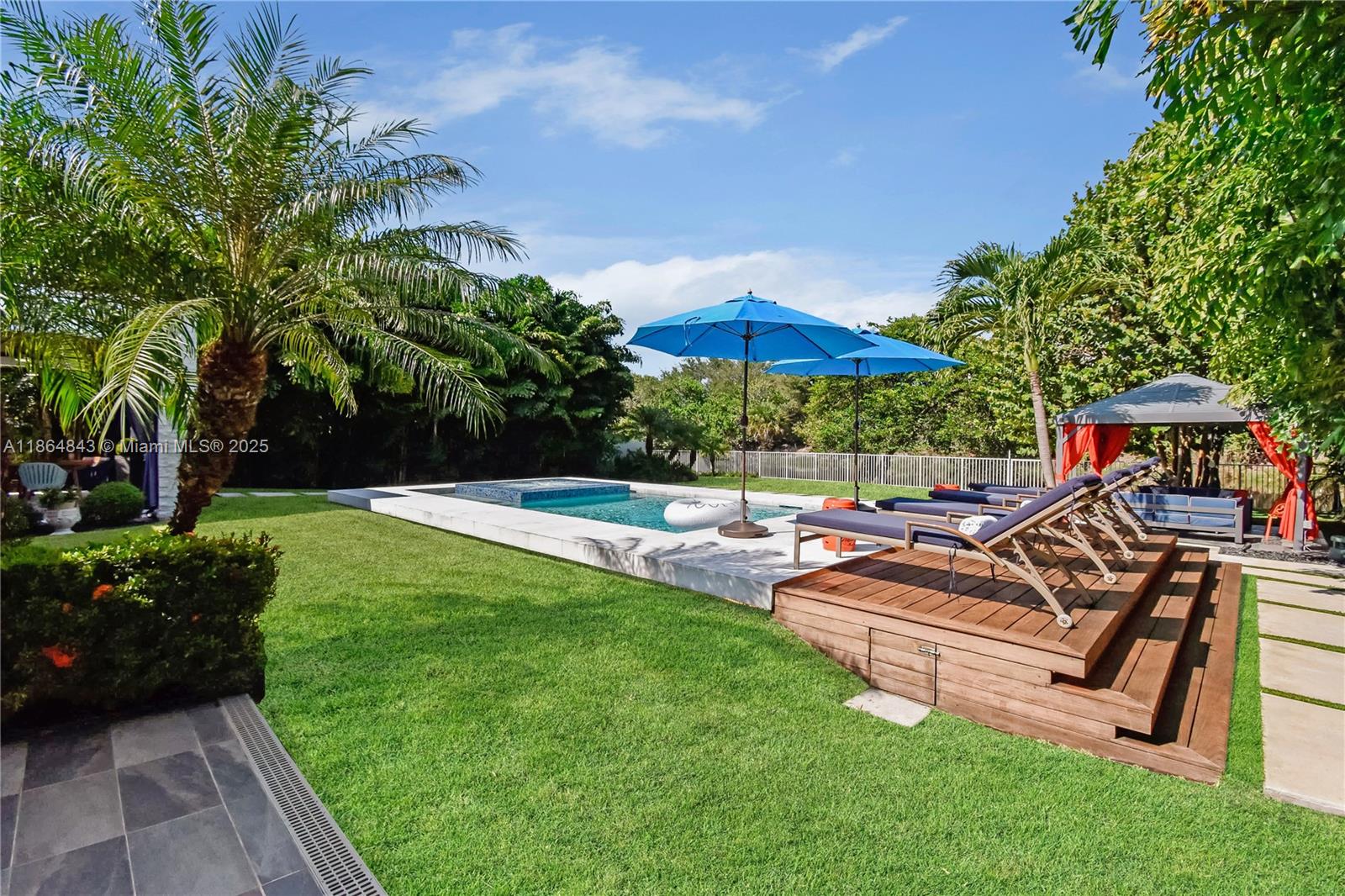 Modern waterfront living in this fully updated 3 BD, 2 BA contemporary home with 1,640 SF of LA in Miami. Located along the Biscayne Canal with ocean access, the property features an electric front gate and sits on a lush, fully fenced lot. Outside, enjoy your paradise backyard with a heated saltwater pool with jacuzzi and stunning water views. Designed for seamless indoor-outdoor living with a covered patio, gazebo, summer kitchen, and LED exterior lighting. Inside, impact windows and porcelanato floors complement the open layout, modern kitchen, and a third bedroom with independent access. No HOA approval required. A rare modern waterfront lease opportunity in Miami! Schedule your private tour today! Also available for sale!