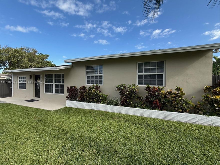 Beautifully updated single family 4-bedroom, 2-bathroom home on a large corner lot.   Bright and airy with lots of natural light from impact windows throughout, brand-new impact door and brand-new stainless-steel appliances with granite countertops, featuring an open concept living space.  Recessed lighting throughout the house including in the newly remodeled bathrooms.  Beautiful natural wood floors, full-size washer and dryer and ample storage. The circular driveway provides adequate parking for multiple cars, while the metal privacy fence includes a sliding gate on one side and a double gate on the other, for added convenience, and safety.  Close to major highways, shopping and entertainment. NO HOA, RAPID APPROVAL!