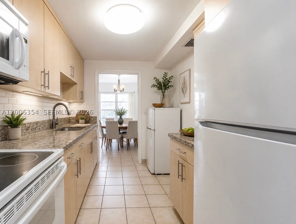 Photo of 4174 Inverrary Dr #202, Lauderhill, FL 33319 (MLS # A12006354)