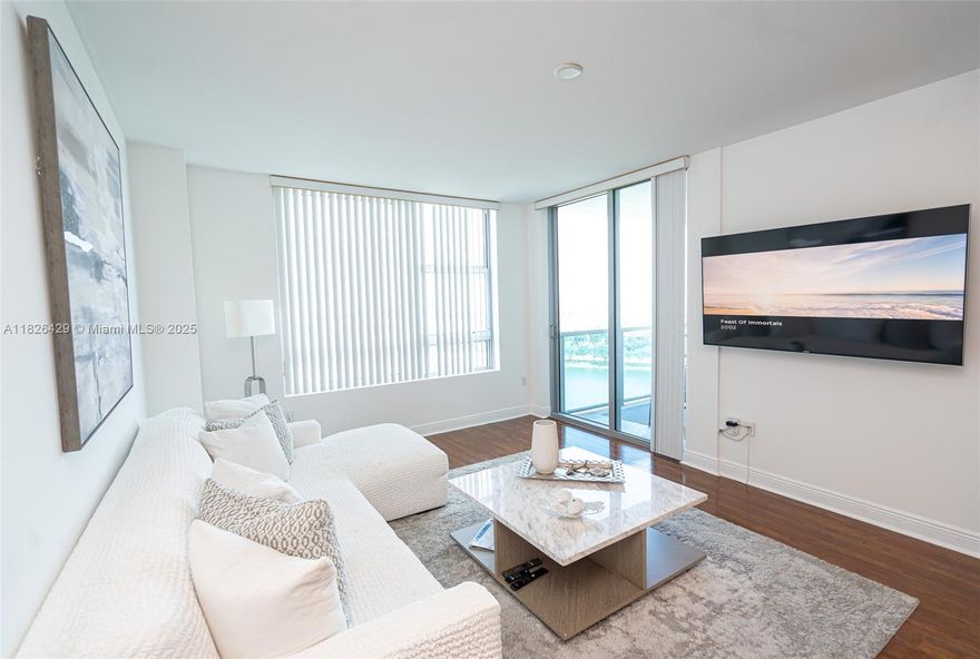 LIVE LIKE YOU’RE IN A RESORT ALL YEAR LONG! Step into luxury with this spectacular apartment at the exclusive Tao Towers, ideally located right across from the iconic Sawgrass Mills Mall in Sunrise, Florida.This residence offers the perfect blend of elegance, comfort, and an unbeatable location from the moment you step into the impressive lobby, where attentive service is always available , 2 Covered parking  (most units only include one space!) Open-concept layout, filled with natural light. Immaculate wood floors throughout, Private balcony with direct lake and pool views, Spacious, modern bathrooms . Full-service spa, sauna, and state-of-the-art fitness center, Tennis court , mini golf and Children’s playground, quick access to major highways.