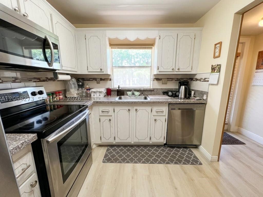 Photo of 9801 Sunrise Lakes Blvd #203, Sunrise, FL 33322 (MLS # A12058273)