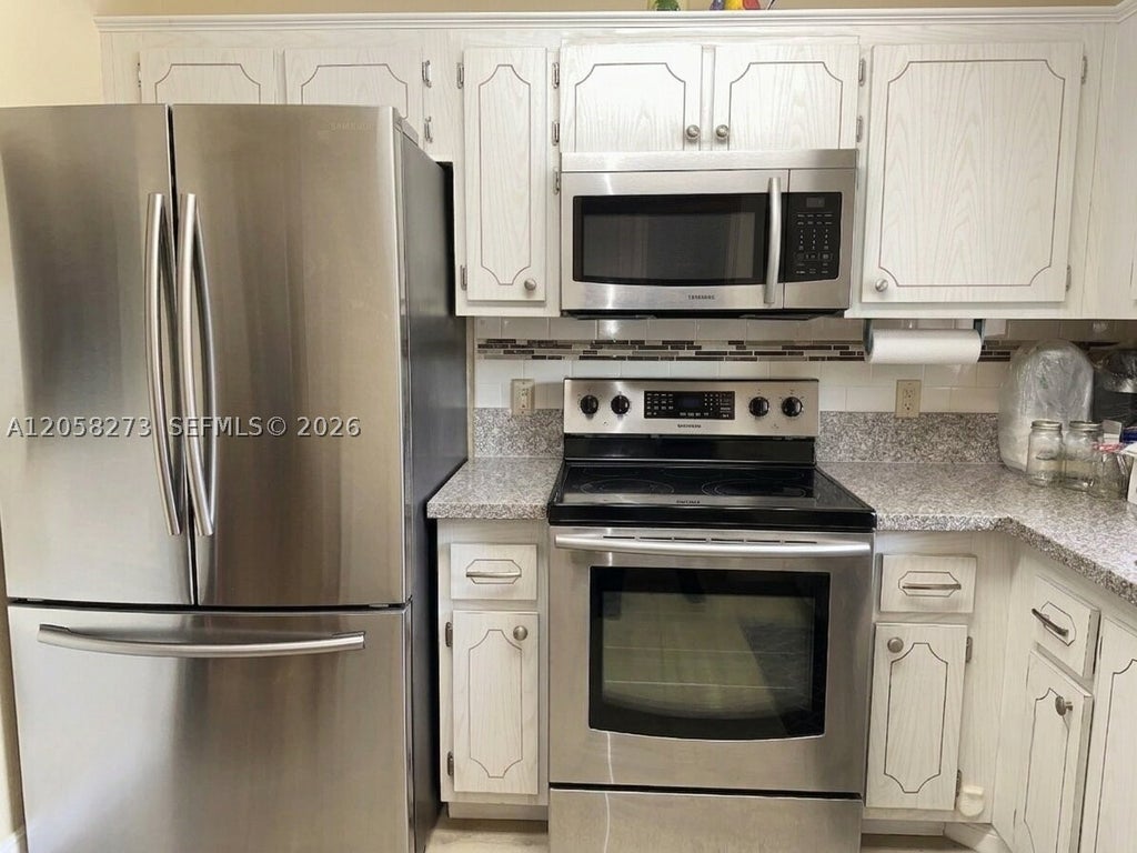 Photo of 9801 Sunrise Lakes Blvd #203, Sunrise, FL 33322 (MLS # A12058273)