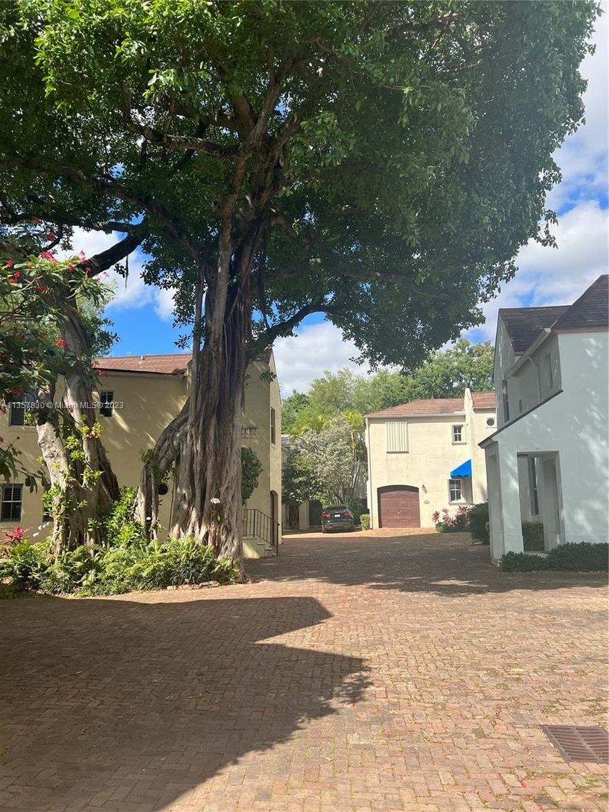 Well maintained unit in the sought after Parisian Village in the heart of Coconut Grove. Gated complex of 13 town homes, inspired by the French Country design. High ceilings on first and second floors. Nice size living and dining room. Functional kitchen. Private, fenced in patio. One car garage with storage plus second parking space next to the unit. Spacious master bedroom with vaulted ceilings. Nice size master bath with large tub. Walk-in closet in the master bedroom with built ins. Complete accordion shutters for openings. Maintenance fee covers exterior insurance, condo liability, water, sewer, irrigation, roof maintenance, gates, grounds care, annual tree trimming, callbox. New roof will be fully paid for by the seller.