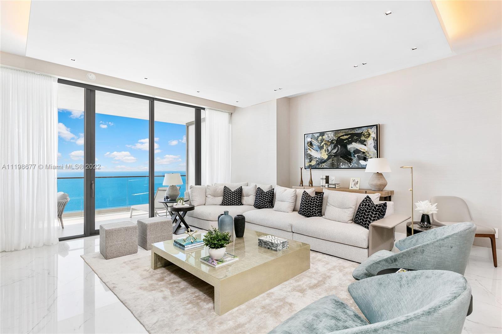 Fabulous 4 bedroom 5 1/2 bath plus library/den or office furnished unit in the world-famous Armani Casa in Sunny Isles on the beaches of the Atlantic Ocean. Double doors open from your private foyer to this furnished home in the sky with cove lighting. The unit is a Southeast flow through with east and west terraces, so you can wake up to beautiful sunrises and view our magnificent sunsets. You have an open kitchen with marble countertops along with Wolf appliances, wine cooler and more. Winter/summer kitchen on ocean side terrace. Porcelain floors throughout. Finished closets. Principle bathroom even has a vanity nook. Designer of the unit is Hernan Arriaga. Incredible amenities including a restaurant and room service. A full service building.