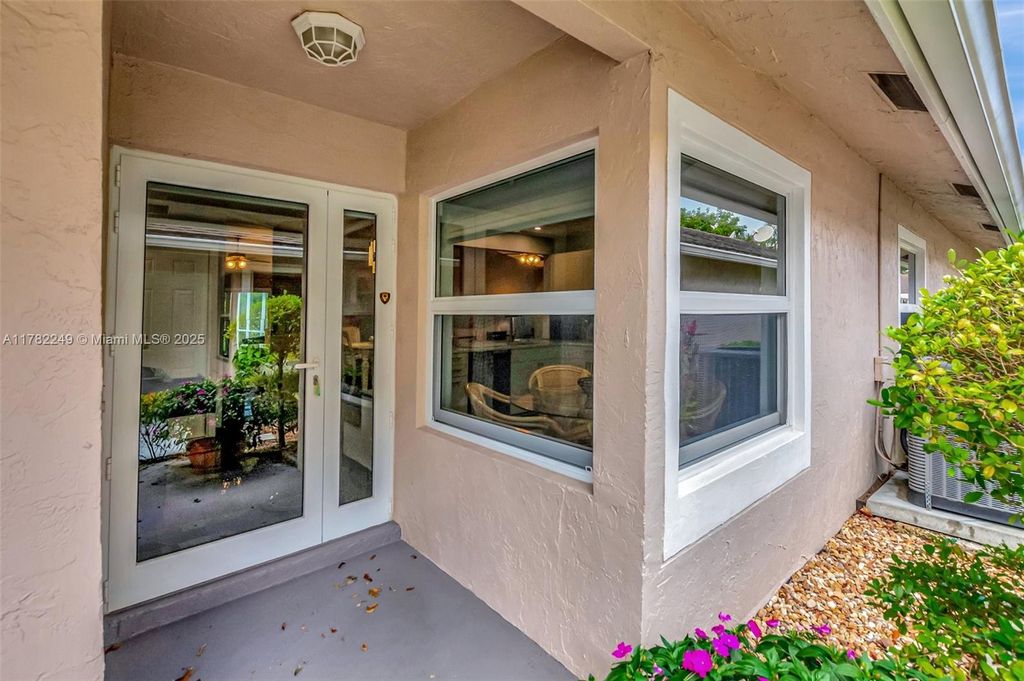 Photo of 1237 NW 52nd Way, Deerfield Beach, FL 33442 (MLS # A11782249)