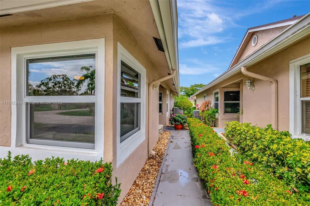 Photo of 1237 NW 52nd Way, Deerfield Beach, FL 33442 (MLS # A11782249)