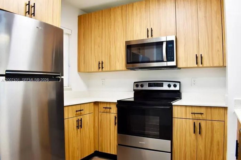 Photo of 4041 N Pine Island Rd #105, Sunrise, FL 33351 (MLS # A12007431)