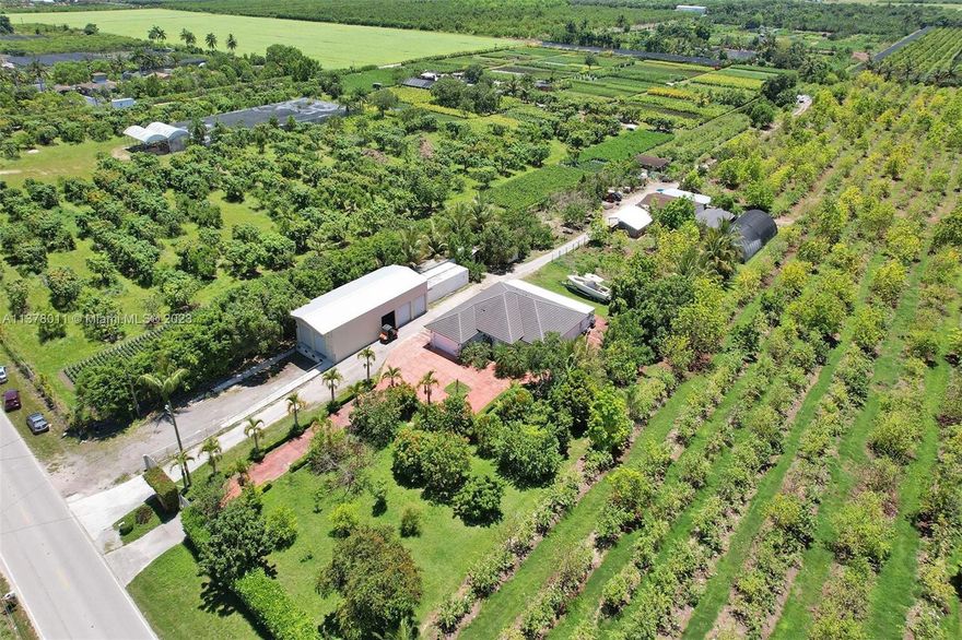 This unique property is situated on 10 acres of land and boasts a variety of tropical fruits, including mamey and guava.  The main house, with a spacious 2,720 square feet of living space, encompasses 3 bedrooms and 2 bathrooms. Built in 1999, it has been thoughtfully updated with a modern kitchen, a new roof installed in 2020, as well as updated AC units and a reverse osmosis system for enhanced water quality. In addition, the property features two 1-bedroom/1-bathroom apartments, providing extra accommodations. Don't miss the opportunity to enjoy the best of both worlds - a peaceful and serene retreat, coupled with versatile spaces that offer a multitude of possibilities, all set within the lush backdrop of a 10-acre landscape adorned with tropical delights like mamey and guavaa