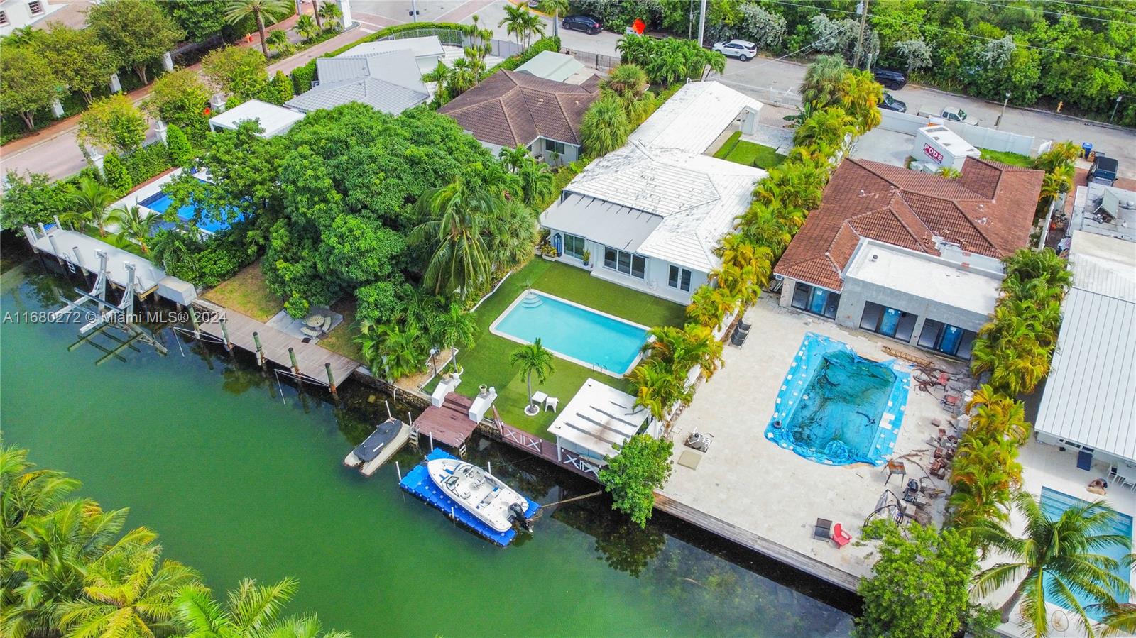 Discover waterfront living in this exceptional Miami Beach home, perfectly situated on a generous 7,950 sq ft lot. This 2,476 sqft residence offers Direct ocean access with NO fixed bridges and features a private dock, ideal for boating enthusiasts, swimming pool.
Designed for both comfort and entertainment, the open layout seamlessly connects spacious living areas with four bedrooms and three bathrooms. The fourth bedroom boasts a private entrance, making it an ideal suite for in-laws or guests seeking privacy.
Enjoy the convenience and security of a gated driveway, all while being centrally located at the entrance of Biscayne Point. You’ll find yourself just a short stroll away from the beach, and within easy reach of vibrant restaurants, shops, and more.