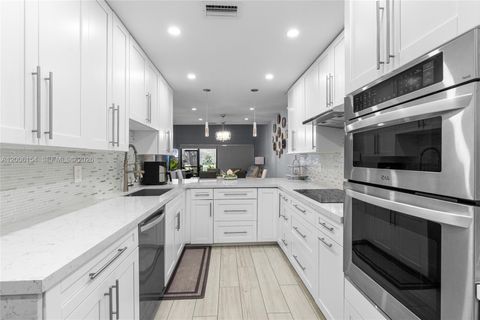 Photo of 1064 NW 97th Ave #219, Pembroke Pines, FL 33024 (MLS # A12006154)