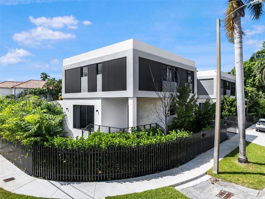 [A Miami Signature Home] TROPICAL MODERN 3300, crafted by the esteemed PRZ Design + Build Group, is an architectural showpiece that perfectly balances privacy and open space. Its striking geometric design and functional elegance create an inviting atmosphere. Inside, you'll discover European porcelain tile floors, a graceful solid oak staircase, and a stunningly designed kitchen serving as the home's centerpiece. A seamless dialogue between interior and exterior, the covered  deck provides the wondrous living experience you so deserve. Enhanced with many smart home features, this residence combines modern convenience with style and sophistication. Ideally located equidistant to the vibrant Coconut Grove and charming Coral Gables, it offers both refinement and unmatched convenience.