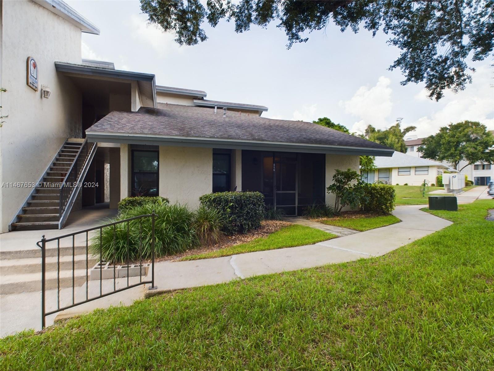 MUST SEE! First floor Winter Haven condo. Super convenient location! Countless amenities including community clubhouse, pool, private mailbox, baseball field, community dock on Lake Lulu. Screened lanai facing the parking lot, with entry to the living room. Vaulted ceilings in the living/dining/breakfast area as well as the master bedroom. Lots of closet for storage including a utility closet on the front screened porch. NEW A/C and updated electric. New ceramic tile, wall/ceiling texture, new paint, new impact windows with cellular shades and sliding doors. New kitchen cabinets and granite countertops with under counter refrigerator and reverse-osmosis water filtration system. Seller financing available.