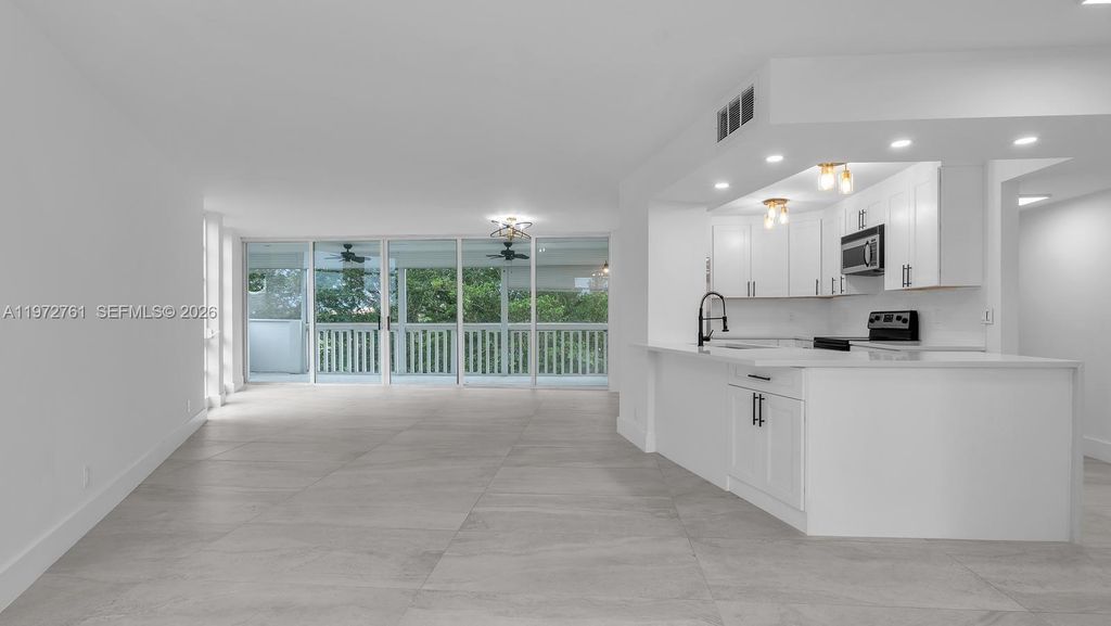 Photo of 6911 Environ Blvd #4J, Lauderhill, FL 33319 (MLS # A11972761)