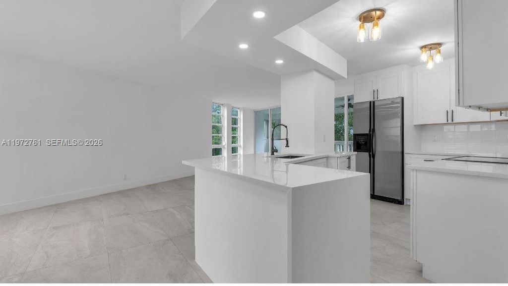 Photo of 6911 Environ Blvd #4J, Lauderhill, FL 33319 (MLS # A11972761)