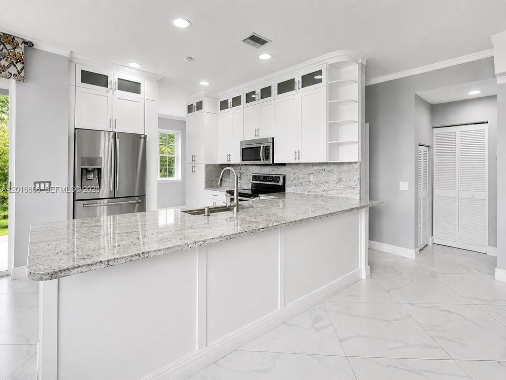 Photo of 963 Falling Water Rd, Weston, FL 33326 (MLS # A12016606)