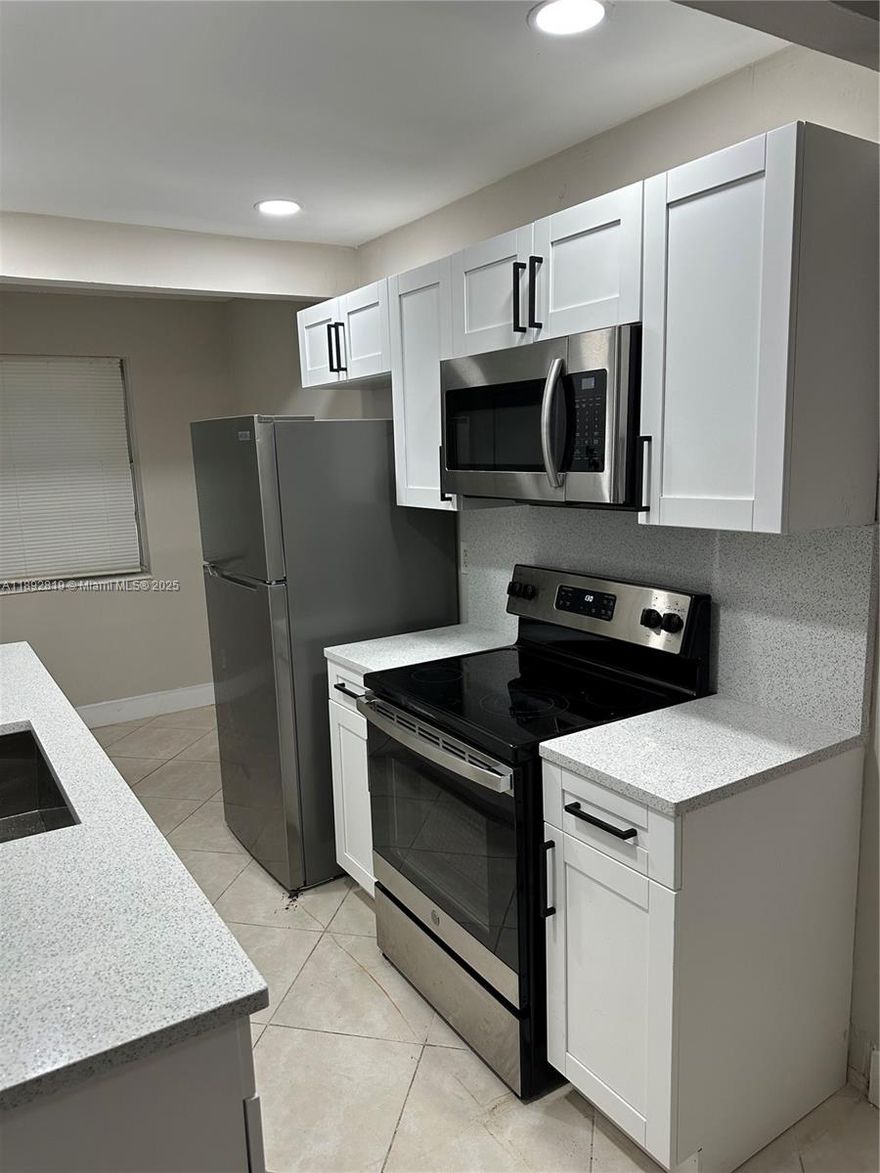 A must see!!! all upgraded new kitchen, countertop, new paint and lots more!!