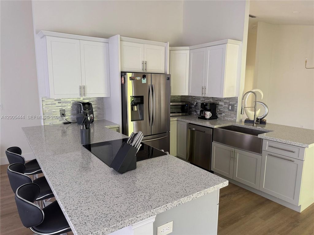 Photo of 8611 NW 51st Ct, Lauderhill, FL 33351 (MLS # A12005444)