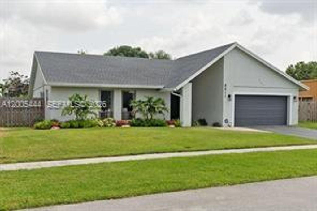 Photo of 8611 NW 51st Ct, Lauderhill, FL 33351 (MLS # A12005444)