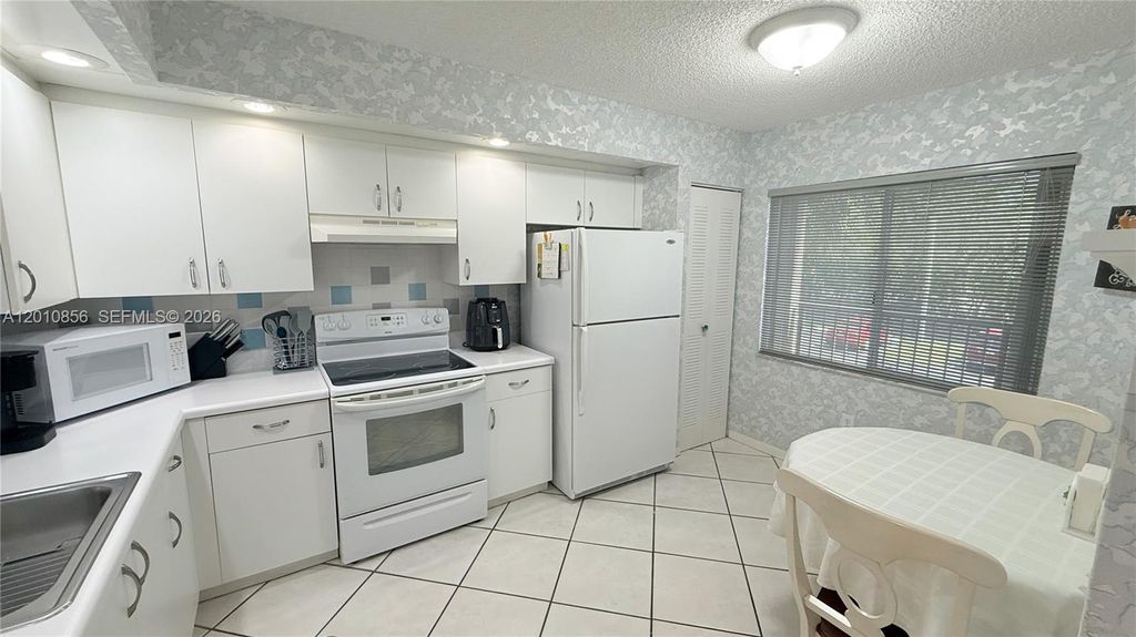 Photo of 12651 SW 16th Ct #202B, Pembroke Pines, FL 33027 (MLS # A12010856)
