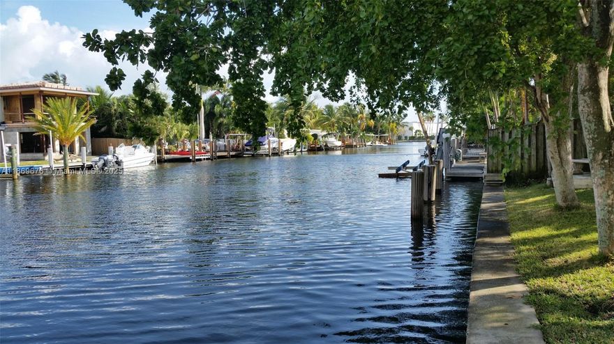 REMODELED 2/2 Ocean access WATERFRONT GEM quiet dead end Street offers the best of E. side living. Beautiful Kitchen TOPLINE LG S/S APPLIANCES! Quartz Counters, Euro soft close cabinetry, Euro Double Farm Sink/commercial gooseneck pullout faucet, Zero Grout Line porcelain floors provide a very contemporary feel throughout home. Contemporary lighting/ window treatments, sliding glass patio doors off bedrooms/living area beautiful views private fenced yard/garage/ water views. EV charger is available.