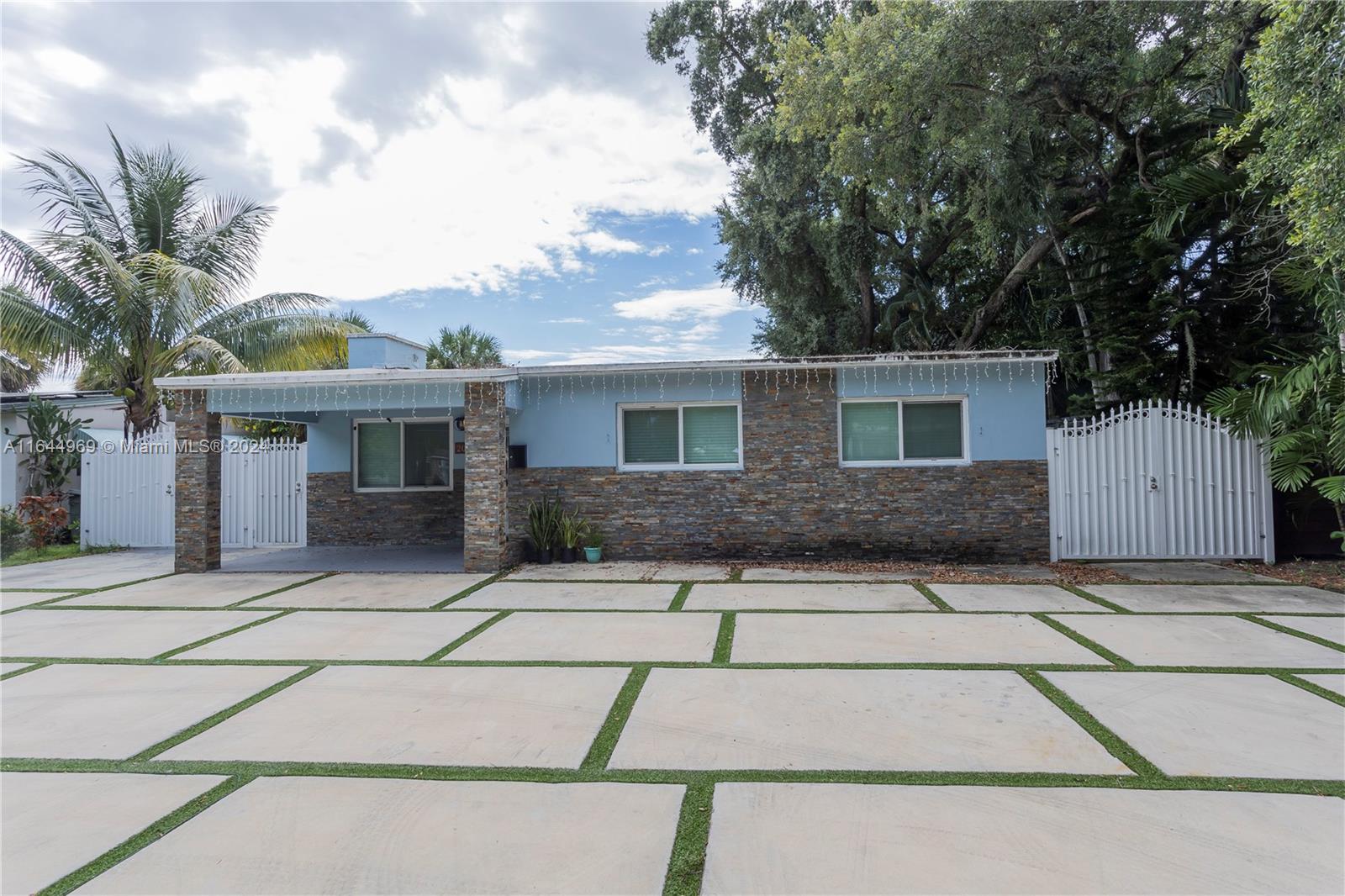 This beautifully renovated four-bedroom, three-bath home in Woodland Park is a hidden gem. Walk to local shops and enjoy quick access to FLL and MIA airports, with Las Olas Beach just 15 minutes away. The property features new flooring, a fresh driveway, impact glass windows and doors, and a new roof installed. Surrounded by vibrant residential and commercial growth, this move-in-ready home offers contemporary comfort in a prime location. Easy to show!