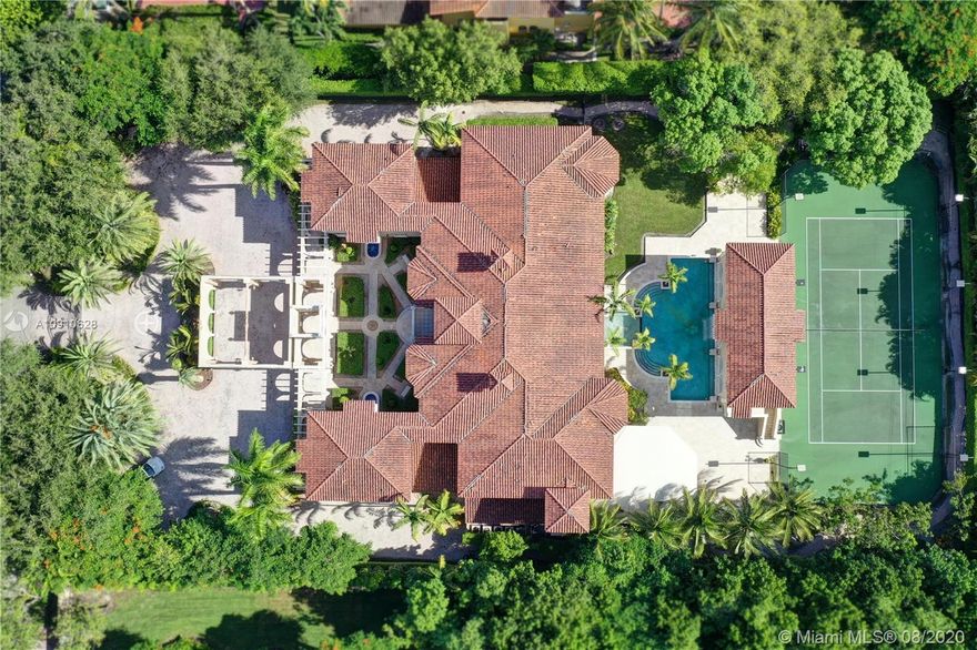 The Palace of Pinecrest! This magnificent estate offers quality & quantity. From a grand gated entrance to lush grounds it starts with a dramatic welcome through an imported Sapeli Spanish door. Luxurious finishes warm the home & the heart including the finest marble, Mahogany custom millwork, palatial staircases, colorful frescos & whimsical custom wall art. Soaring coffered ceilings provide the perfect design for natural light to pour in. Enormous social rooms include a chef inspired kitchen off the family room, exquisite formal dining, living room with fireplace, billiard room, and gym. Master Suite secluded on the 1st floor complete with fireplace & huge walk-in closets. Grounds are complete with guest house, tennis court, cabana, & summer kitchen. Home Generator & SmartHome technology