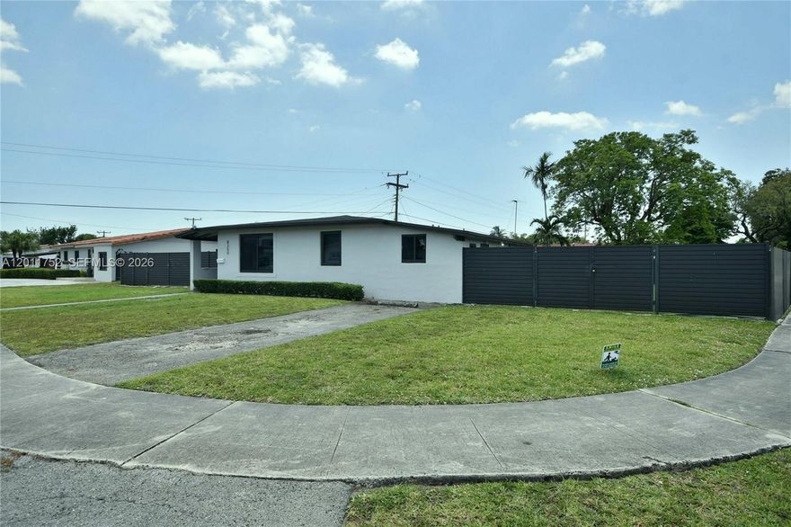 HUGE CORNER LOT with plenty of room for additions as well as a pool, all surrounded by new high gate for privacy.  Large gate doors that can open for wide loads like construction equipment or boat storage.  REMODELED KITCHEN with SS appliances and large under mount sink plus soft close cabinets that go to the ceiling for more storage room and less dusting.  GAS STOVE with multiple burners that can be used even in a hurricane. TINTED HURRICANE WINDOWS and DOORS. Garage legally converted into storage area and laundry room. PLENTY OF PARKING. Opaque glass front door for even more light. Zebra shades in the L shaped living and dining room area to bring in light while maintaining privacy.  Sliding doors in the living room straight to the side yard where a pool can be added. EXCELLENT LOCATION! Quiet street with surrounding house that are very well maintained.  Easy access to the Palmetto and Dolphin Expressways.  Close to 87th Ave and 8th Street for plenty of shopping within walking distance should someone not have a car while at home.  WILL NOT LAST!  PERFECT LOCATION IN MIAMI!