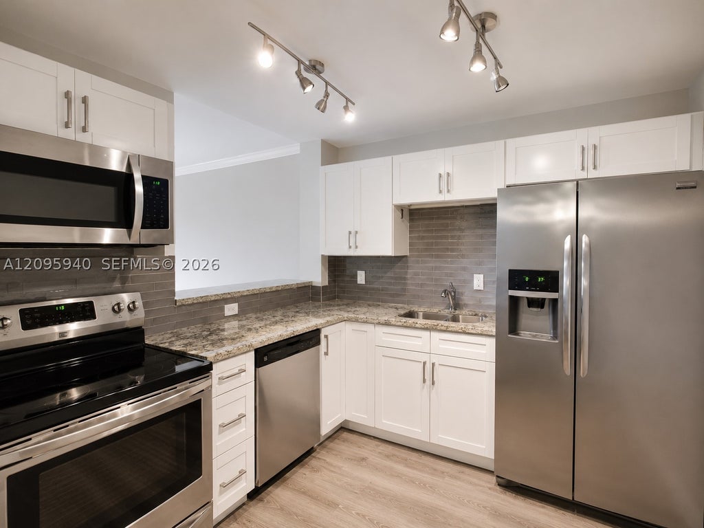 Photo of 1881 Middle River Dr #604, Fort Lauderdale, FL 33305 (MLS # A12095940)