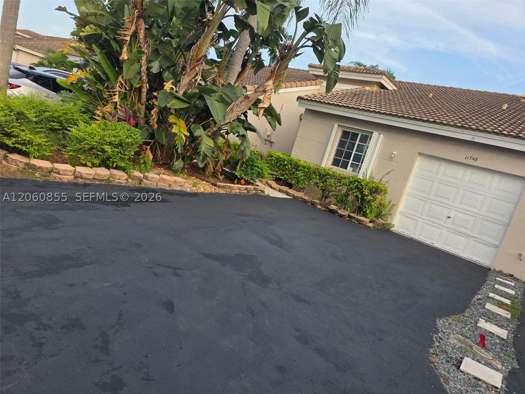 Photo of 11748 SW 17th Ct, Miramar, FL 33025 (MLS # A12060855)