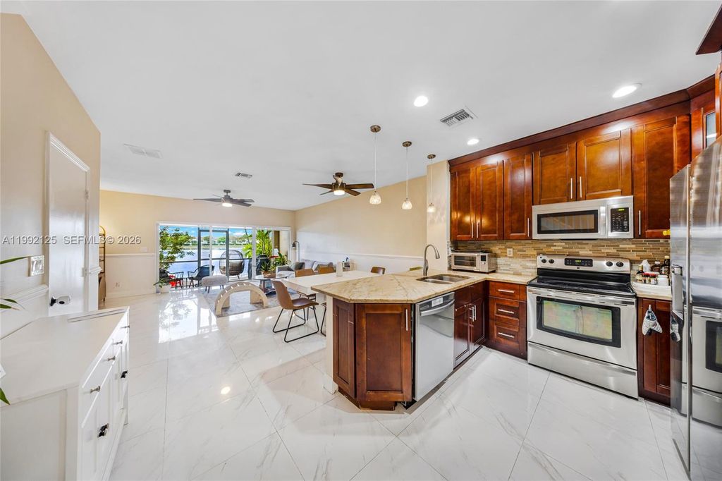 Photo of 12158 SW 5th Ct, Pembroke Pines, FL 33025 (MLS # A11992125)