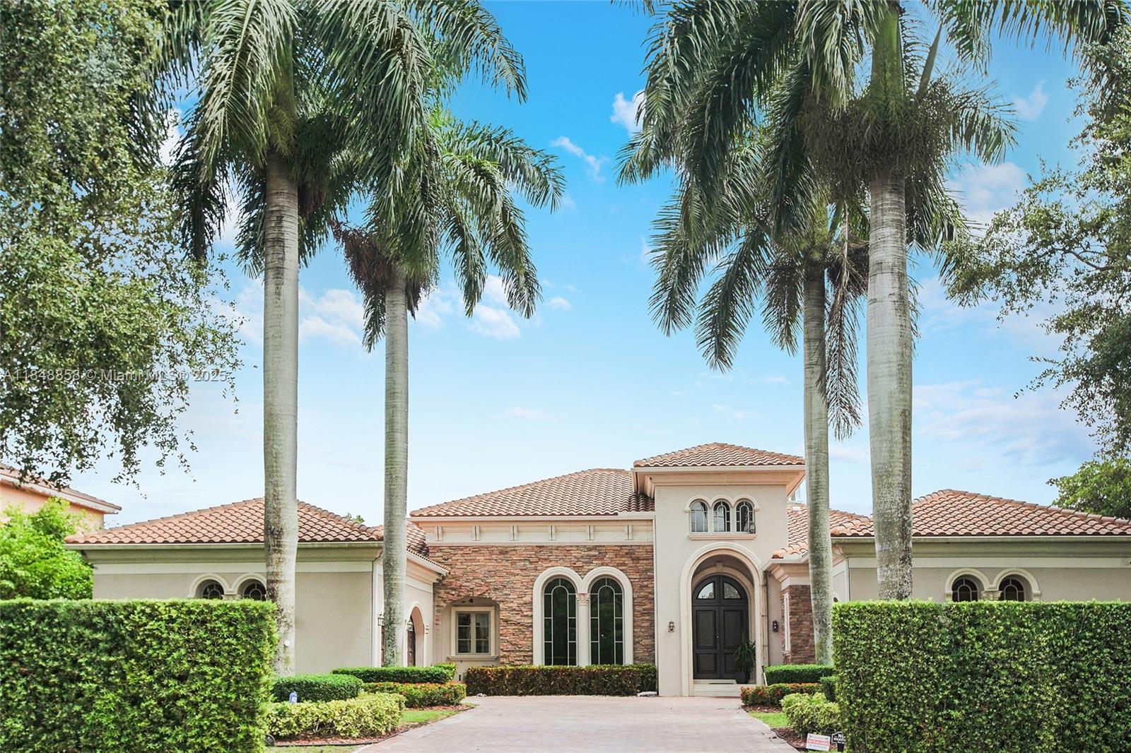 Exquisite Estate in Prestigious Saddle Club Estates.Tastefully decorated 5bed/5.5bath custom home boasts 5179' living space w/elegant finishes & upgrades.Oversized master suite w/2 closets, spa-like tub&shower. 16' coffered ceilings, open layout featuring 2 living areas, marble&wood floors, custom walk-in closets&built-ins, huge gourmet kitchen w/Miele and Subzero, 2021 roof, 3 AC, impact windows&doors,3 car garage w/EV charger, full house generator.Specious front yard w grand palms and large back yard w/heated saltwater pool and child gate, full outdoor kitchen w/pergola, multiple fruit trees.This home provides privacy and serenity while being conveniently close to top-rated schools, shopping and recreation w/ access to Bonaventure Town Center Club. Come experience it in person!