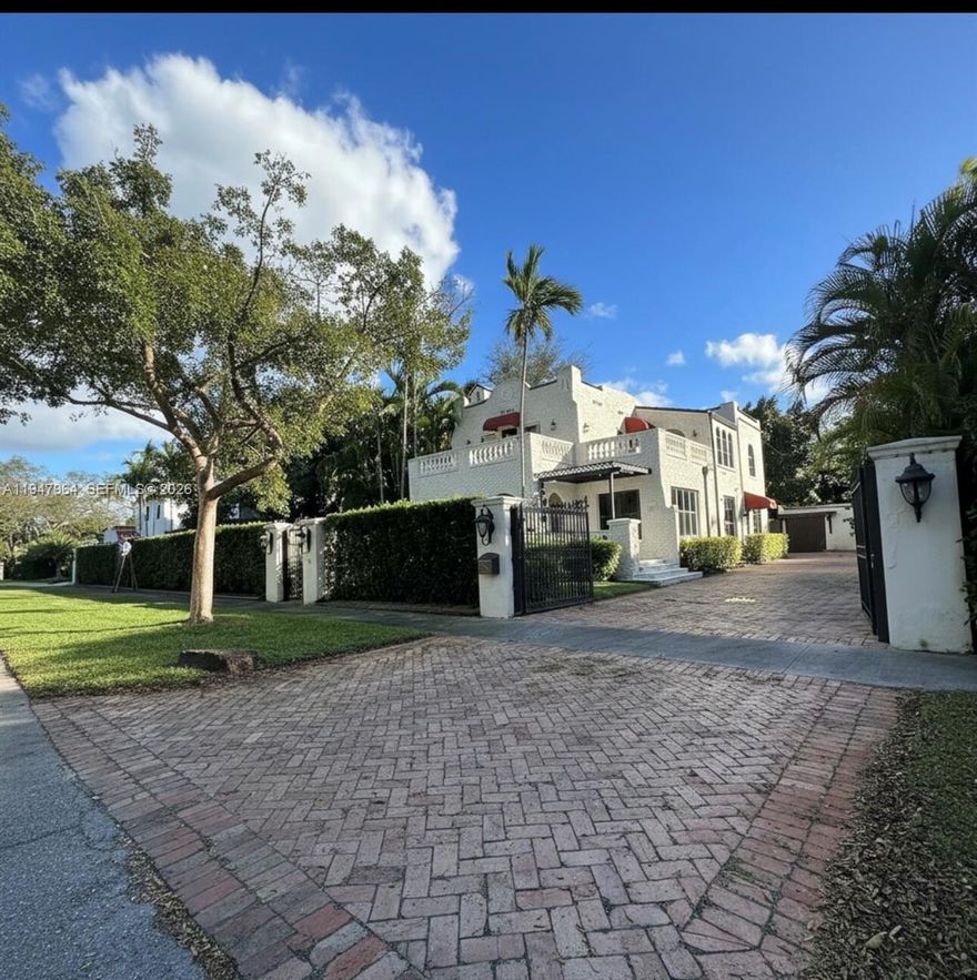 EL PORTAL'S MOST DESIRABLE STREET & LOCATION THE LARGEST LOT IN THE AREA This masterpiece is offering over 17,000 square feet of lush grounds, this extraordinary estate delivers space, privacy, and a wow factor at every turn. Fully upgraded impact windows and doors Throughout the entire property. CHARMING CURB APPEAL. The main residence is complemented by a guest house, a beautiful summer Kitchen with a serene koi pond that anchors a tropical oasis designed for both grand entertaining and peaceful retreat.