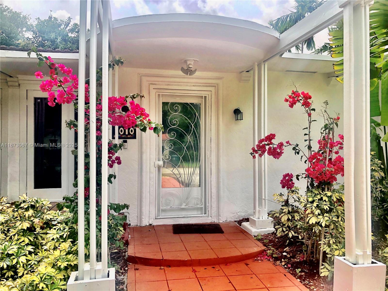 Serene Retreat ! Nestled in a lush tropical landscape. 3/2home in a family oriented neighborhood. Tropical Paradise, Surrounded by lush foliage, Majestic trees, Swaying palms trees, shaded by trees. Bright & Airy. Florida natural pine wood. Open living and dinning area, floor-to-ceiling French glass doors, natural light and relaxing views. Pergola. Lounge area by the master bedroom. Private Guest or in- Cottage , a large third bedroom, private access , full bathroom conveniently located just outside the room. New central AC with heat pump & ductwork, mini split systems with heat pumps New paver driveway for five cars. Flat roof improvements installed December 2024. Washer & dryer. Stainless steel appliances New drain field. Rented until June 2026 $4000 Negociable
