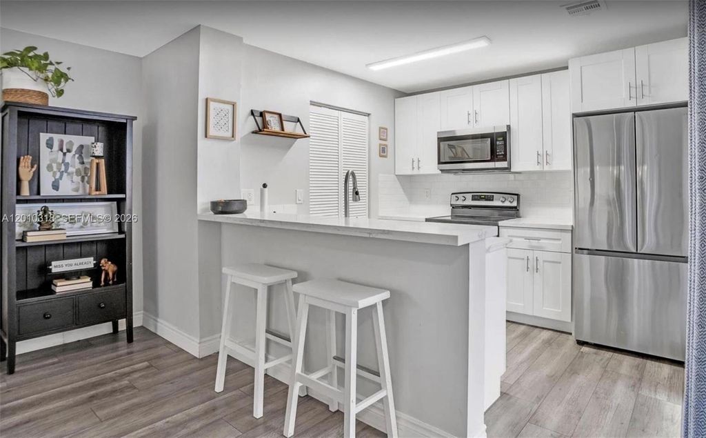 Photo of 8033 NW 71st Ct #8033, Tamarac, FL 33321 (MLS # A12010318)