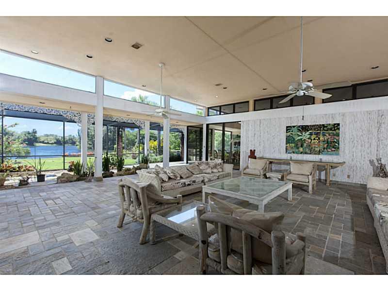 Gated lakefront estate in Snapper Creek Lakes; guarded entrance into exclusive Gables community; huge fully private lot; 150' of lake frontage; lakeside beach retreat; exotically landscaped paradise; Pancoast designed home featuring 6 bdrms & 7.5 baths pl us in-law suite with kitchen & separate bath; walking distance to Pinecrest Elementary and close to elite public & private schools; private marina available to boaters with direct access to bay. This is undoubtedly the best lot in Snapper Creek Lakes.