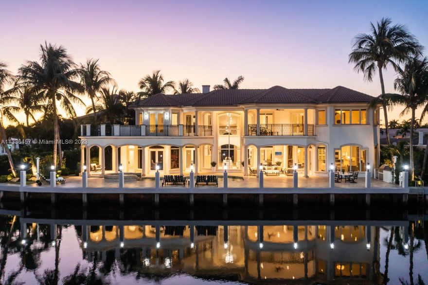 Breathtaking, one-of-a kind villa on a prime waterfront point-lot in prestigious & secluded Boca Bay Colony. 130’ of water frontage. Updated, transitional-style interior spaces feature water views, double-height ceilings, walls of glass & exquisite custom finishes, fixtures, and Smart Home systems throughout. Embrace the indoor/outdoor living created by an open layout w/formal living, dining, family room + an oversized & elegant wood-paneled office/library. Expansive kitchen w/wood cabinetry, Wolf & Subzero appliances, butler’s pantry & breakfast area. Luxurious primary suite offers 2 walk-in closets, large terrace & new spa-like bath. Full house generator. Enjoy the resort-like outdoor spaces w/heated pool & summer kitchen while overlooking the deep & wide, ocean access waterway.