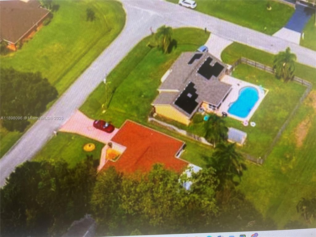 Photo of 2492 SE Rival Ave, Port St Lucie, FL 34952 (MLS # A11898096)