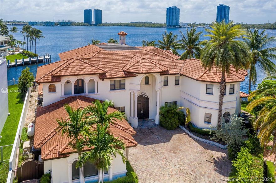 This Mediterranean Villa Estate boasts 202 feet of water frontage in an oversized corner lot located inside the gated community of Eastern Shores. Featuring South & West views- splendid sunsets take center stage every evening here, perfect for entertaining.
This unique 7,792 sq ft Villa features 7 BR+9 BA with floor to ceiling windows providing plenty of natural light and a dramatic grand foyer entrance with double staircases, panoramic water views and luxurious finishes throughout: gourmet kitchen with top of the line appliances, formal dining room, media room, balconies, a master suite with outdoor terrace, huge pool & outdoor deck with summer kitchen. 
A private dock on a no wake zone area with easy access to the Ocean and no fixed bridges, makes this truly a Boaters Dream come true.