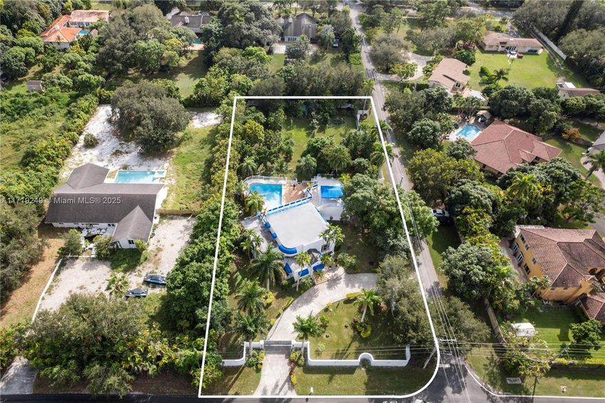 This stunning 1-acre estate in the heart of Miami offers endless possibilities! This spacious and versatile home has five bedrooms, 5 baths, and a 3-story layout with a rare basement. Utilize the 3-car garage for ample storage.  The primary bedroom is conveniently located on the first floor, with a large terrace on the second. Enjoy a tropical setting with a pool and outdoor bar, along with four gated entrances for ultimate privacy. Zoned to allow for a second house or guest house, this property provides incredible potential for expansion. Update to your taste, or start fresh and build your dream home.  Contact Shana to schedule your private viewing today. Property square footage larger than tax roll.