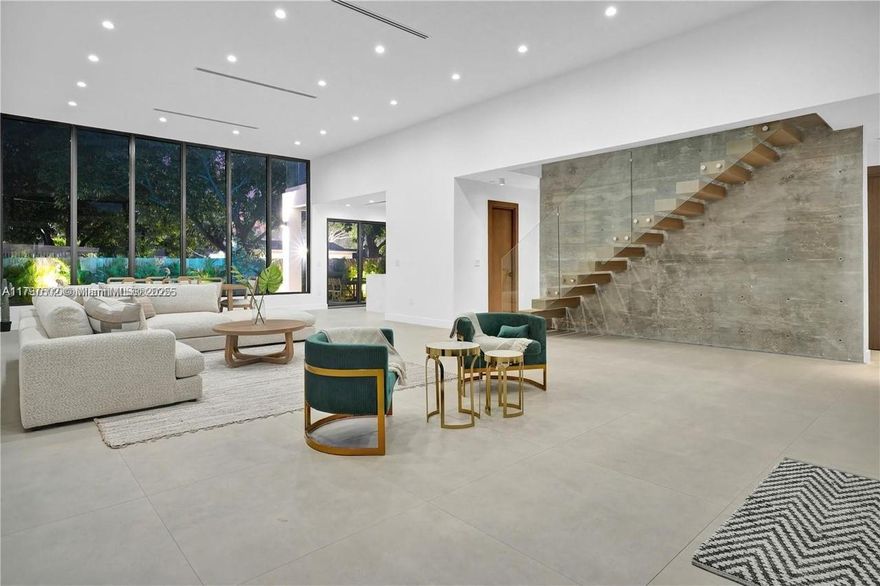 This stunning new build offers 5 bedrooms, 5.5 bathrooms, and a private 1 bed/1 bath guest cottage. Enjoy a sleek modern design with smart home tech throughout. The kitchen features LED lighting, a hidden walk-in pantry with wine cooler, Kohler pot filler, and a wine room. Interiors are staged by Modani, and the outdoor kitchen includes Mont Alpi grill with kegerator. The primary suite includes a Moen smart toilet and Kohler digital shower, all controlled by touchscreen, iPad, or phone. Additional smart features include a camera system